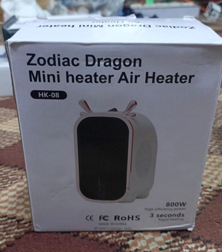 WhatsApp-Image-2024-10-26-at-11.32.34-PM.jpeg Zodiac Dragon Mini Portable Electric Desk Air Heater for Room, Small Tabletop Fan - 800W (Random color) - Image 1